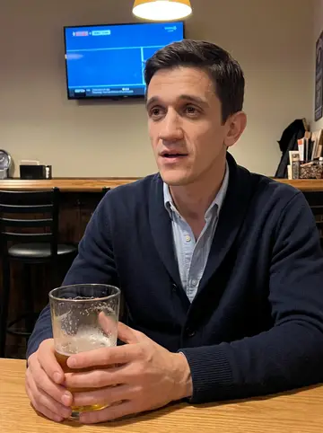 Alexei, AI character: a quiet Pittsburgh neighborhood bar after a school tuning job, a Pirates game playing silently on a wall…