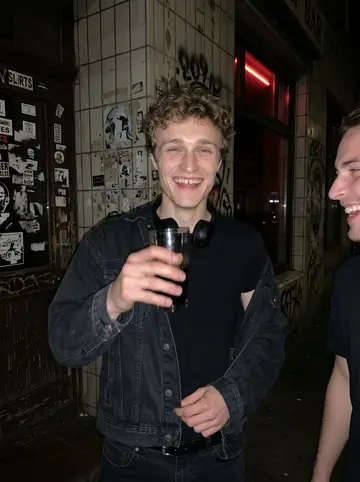 Mariusz, AI character: outside a cheap corner bar in St