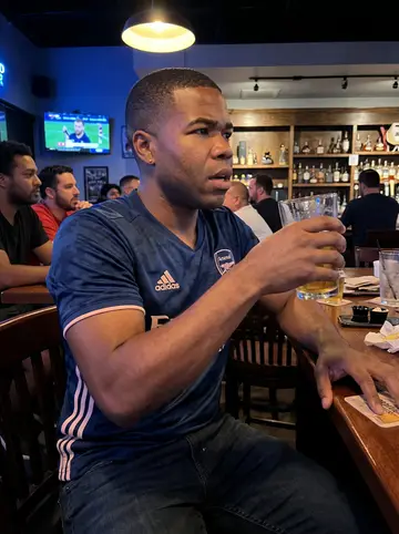 Emeka, AI character: a casual Dallas sports bar during an Arsenal match watch party with friends