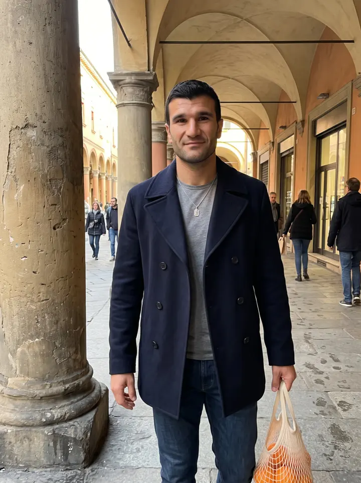 Ignazio, AI character: under the long porticoes of Bologna near Piazza Santo Stefano, late afternoon, a few pedestrians behind…