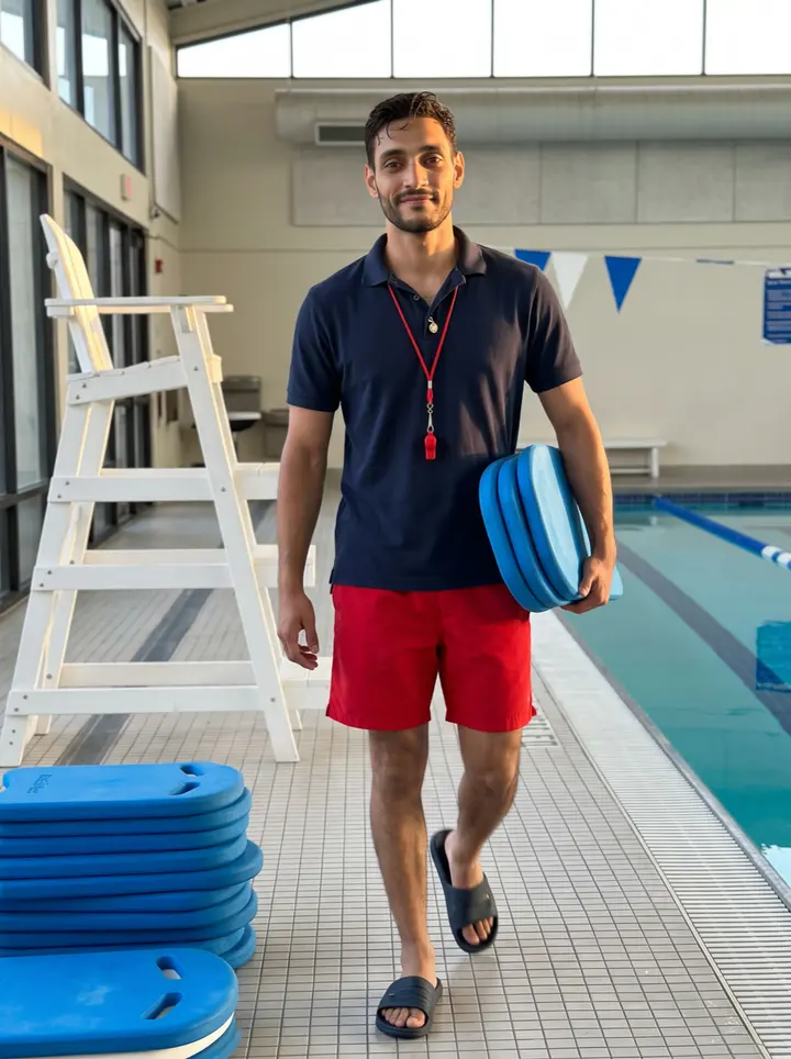 Rogelio, AI character: the rec center pool deck on Alameda after evening swim lessons, the tall white lifeguard chair and blue…