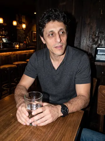 Bartolomé, AI character: a low-key Spanish bar in Los Angeles after watching a Valencia CF replay with two friends