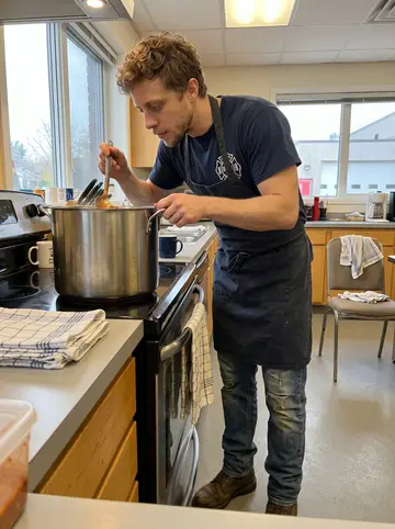 Trent, AI character: the fire station kitchen on chili Wednesday, big pot on the stove, folded dish towels and mugs around the…