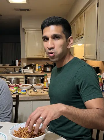 Khaled, AI character: his mother's Houston kitchen during a Friday koshari dinner, pots and bowls crowded on the counter