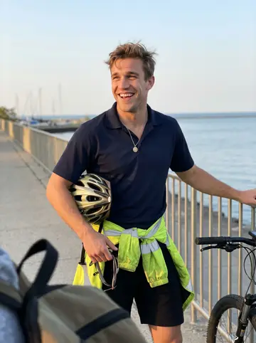 Marek, AI character: the lakefront trail near Montrose Harbor at the end of his shift, leaning against the railing next to his…