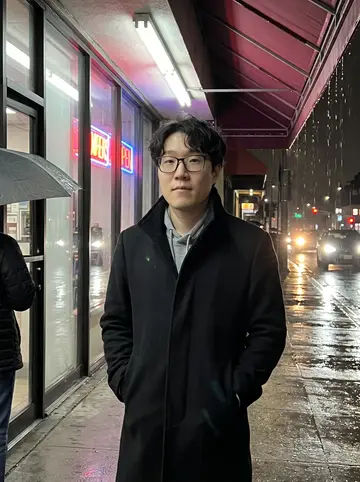 Daniel, AI character: late-night taco truck parked on a Koreatown side street, folding table on the sidewalk, neon karaoke signs…