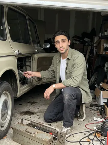 Christophe, AI character: a rented garage in Little River where he is restoring a 1970s Citroën on weekends