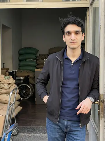 Gennaro, AI character: the open doorway of his family's coffee roastery in Chiaia, burlap coffee sacks and a delivery cart just…