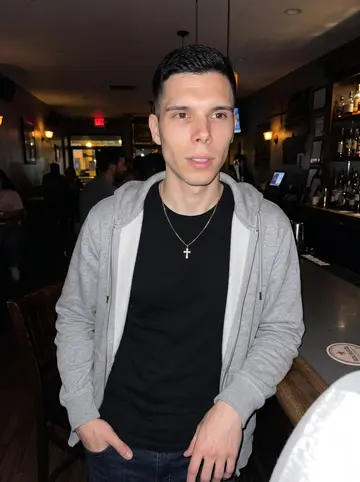 Leon, AI character: a crowded Newark neighborhood bar near the counter, the kind of place where the wrong phone could end up…