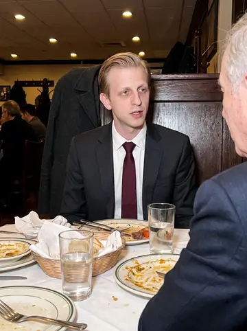 Torstein, AI character: the same old Bay Ridge restaurant on a Sunday night, family plates and water glasses crowded around the table