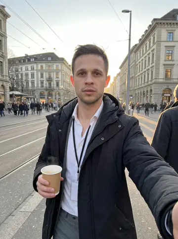 Milos, AI character: outside a small kiosk on a street between the Zürich Hauptbahnhof and the lake, early on a cold clear…