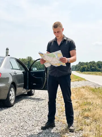 Elias, AI character: a rural Ohio roadside pull-off during one of his long silent drives, the car door open and a thermos on…