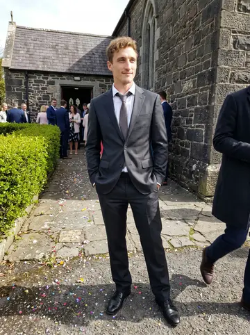 Brendan, AI character: outside a stone parish church in County Mayo after a cousin's wedding, guests mingling and a hedge of new…