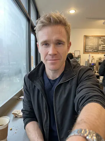 Hugh, AI character: a small Pittsburgh coffee counter before an early shift, fogged front window and a paper cup on the narrow…