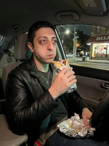 Haris, AI character: inside his parked car on a Queens side street at 1 a