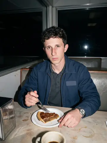 Sawyer, AI character: a booth in a highway gas-station diner outside Salina at night, a slice of pecan pie on a paper plate and…