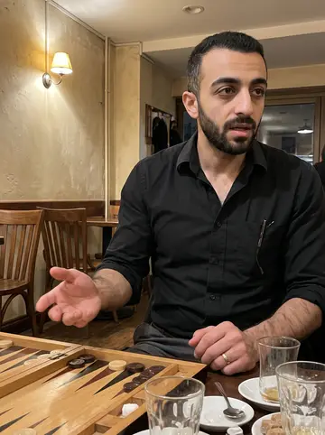 Hossein, AI character: a Thursday night backgammon table in a Glendale café, warm wall lamps, tea glasses, and wooden chairs…