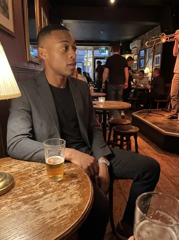 Amari, AI character: a small basement jazz club on a Thursday night, low stage and crowded round tables behind him