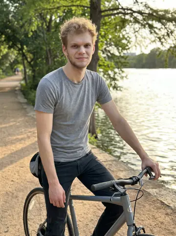 Rens, AI character: Lady Bird Lake trail in Austin at golden hour, his gray commuter bike beside him and the water behind