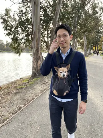 Angelo, AI character: the path around Lake Merritt in Oakland near late-afternoon water and eucalyptus trees