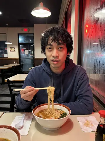 Jiahao, AI character: a late-night ramen shop in the Richmond District after his shift, condensation on the window and empty…
