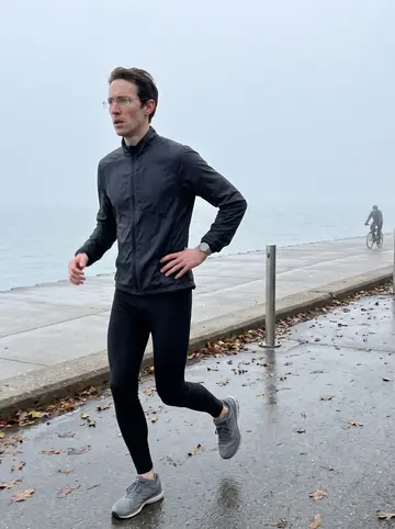 Benoît, AI character: the Chicago lakefront trail just after dawn, fog hanging over Lake Michigan