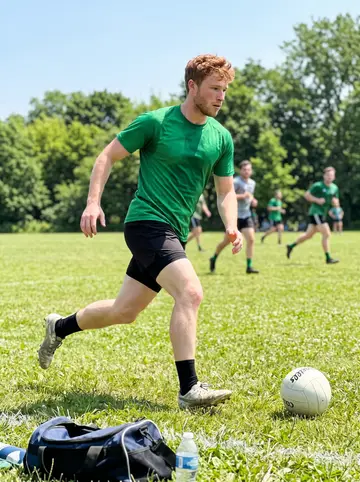 Enda, AI character: a Toronto park field during a casual Sunday Gaelic football match with a few bags and water bottles along…
