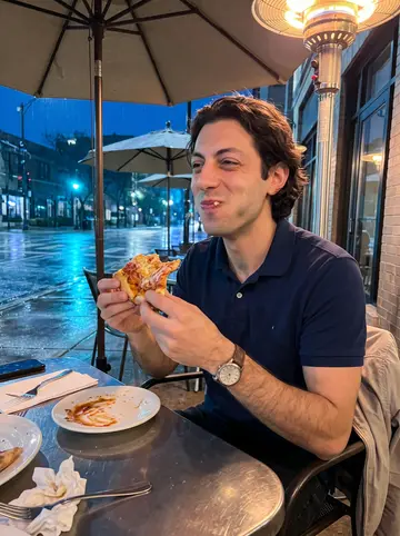 Agostino, AI character: covered outdoor table at a casual Italian spot in Chicago after spring rain, wet pavement and umbrellas…