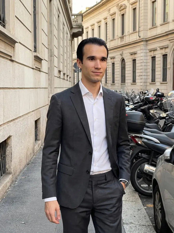 Oliviero, AI character: a quiet side street near Brera in Milan after work, pale stone buildings and parked scooters behind him