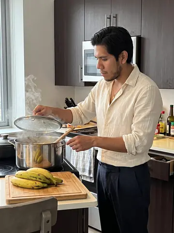 Maximiliano, AI character: his apartment kitchen on a Sunday, a big pot of sancocho on the stove and plantains on a cutting board