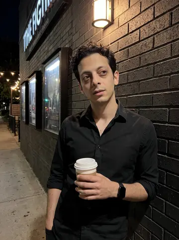 Jaime, AI character: outside an Austin independent cinema after a late Spanish thriller screening, poster cases and patio…