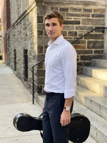 Sebastian, AI character: outside a small Philadelphia recital hall after a hospital benefit rehearsal, holding his worn…