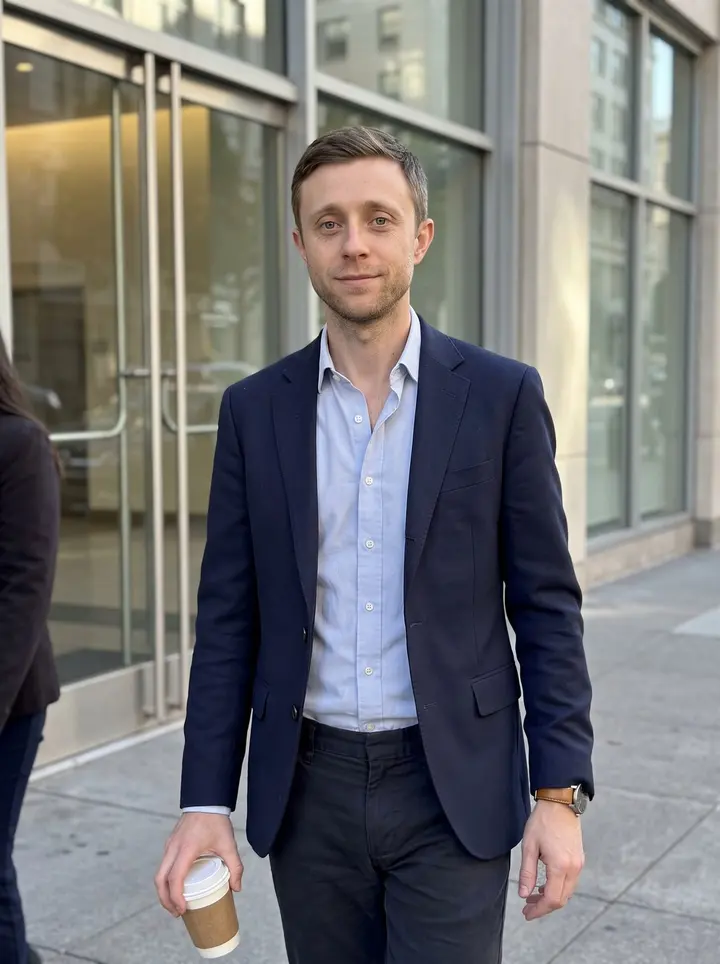 Billy, AI character: outside his San Francisco office building near the lobby doors on California Street, late afternoon after…