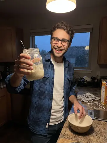 Stephen, AI character: a coworker's apartment kitchen after work, rain streaking the dark window while he rescues a sluggish…