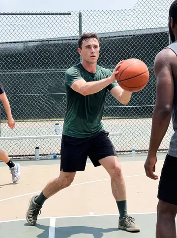 Louis, AI character: an outdoor pickup basketball court in Atlanta with his crew foreman and the foreman's nephew cropped at…