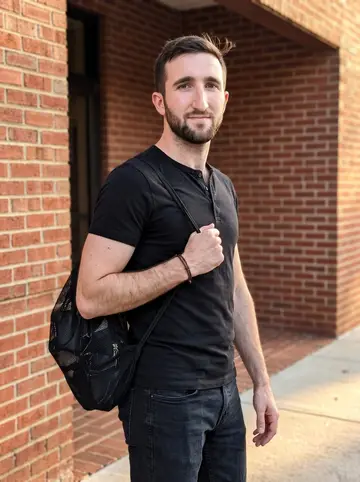 Jayden, AI character: outside a Raleigh dance school after evening Latin rehearsal, standing near the brick entrance with his…