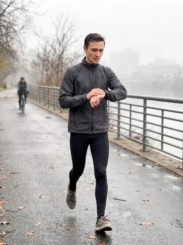 Paweł, AI character: Schuylkill River Trail just after dawn, damp path, river railing and pale skyline in the background