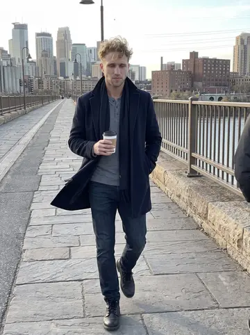 Kim, AI character: Stone Arch Bridge in Minneapolis during a cold autumn walk between the café and the rink