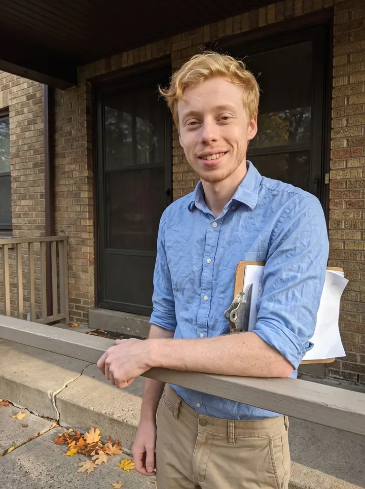 Robin, AI character: outside a brick Minneapolis duplex after a house appraisal, maple leaves on the sidewalk and his measuring…