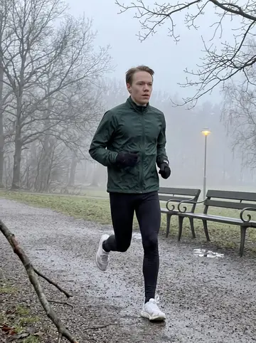 Hampus, AI character: a damp gravel path in Slottsskogen at 6 a