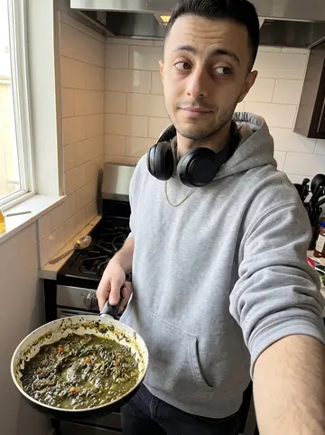 Mehdi, AI character: his apartment kitchen in Irvine on a weekend morning, stove and tile backsplash behind him