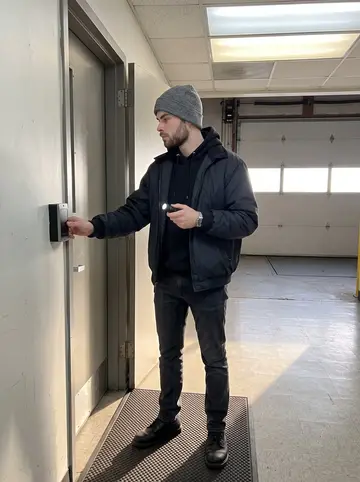 Innes, AI character: the service corridor outside the data center loading bay in Pittsburgh near the end of his night shift