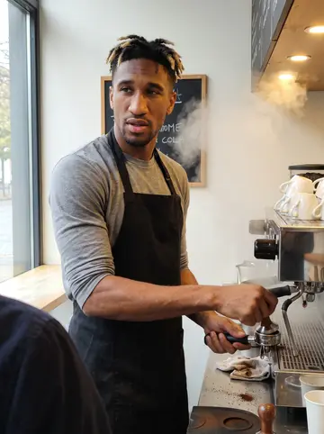 Alessio, AI character: behind the counter of his cousin's small Italian coffee bar on College Street, chrome espresso machine,…