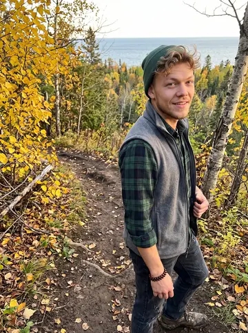 Nick, AI character: a Superior Hiking Trail overlook above Lake Superior outside Duluth, yellow birch leaves and dark water…